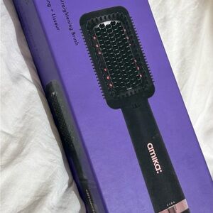 Amika Double Agent 2 in 1 Blow Dryer + Hair Straightening Brush.
